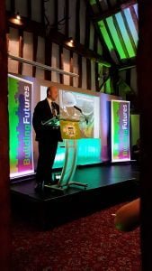 Presenter on stage building futures award