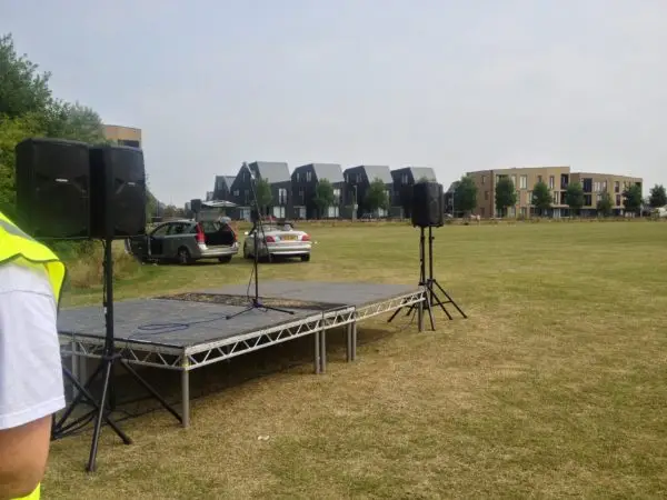 Small fete stage and pa system on a field